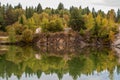 Stunning photo of fall foliage reflected on a lake with a glass like mirror water surface Royalty Free Stock Photo