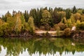 Stunning photo of fall foliage reflected on a lake with a glass like mirror water surface Royalty Free Stock Photo