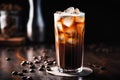 Refreshing Cold Brew Coffee with Ice Cubes on Dark Wooden Background Royalty Free Stock Photo