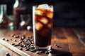 Refreshing Cold Brew Coffee with Ice Cubes on Dark Wooden Background Royalty Free Stock Photo