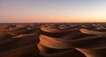 Desert dunes glow under a beautiful twilight sky Royalty Free Stock Photo