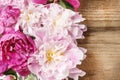 Stunning pink peonies on rustic wood