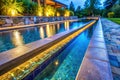 Stunning Pool Edge Detail Natural Stone Gutter and Overflow Drainage System with Dramatic Lighting Royalty Free Stock Photo