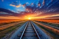 Stunning railway track stretching into the mesmerizing horizon under the enchanting sunset Royalty Free Stock Photo