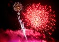 Stunning red fireworks balls exploding on the sky at night Royalty Free Stock Photo