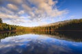 Stunning reflection on lake in early winter morning