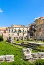 Stunning ruins of the Temple of Apollo in Ortigia Island, Syracuse, Sicily, Italy captured on a vertical photo with blue sky. Royalty Free Stock Photo