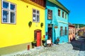 Medieval saxon street with colorful buildings in Sighisoara, Transylvania, Romania Royalty Free Stock Photo