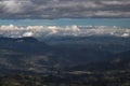 Stunning scene of Colombian andean mountains with green valley and blue cloudy landscape