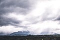 Stunning scene landscape during a cloudy day with sun ray through the cloud over the snow mountain. Dramatic photo style. I