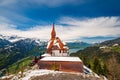 Stunning scenery with mountain hut on top Harder Kulm summit - popular tourist attraction over Interlaken, Switzerland