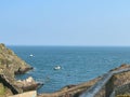 Stunning seascape featuring rocky coastal cliffs, with tranquil waves lapping against the shore Royalty Free Stock Photo