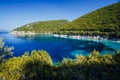 Stunning seaside scenery of the cove with turquoise calm sea water, surrounded by hills overgrown with pine and olive