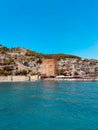 Stunning seaside view of the Alanya Red Tower in Turkey with boats near the shoreline