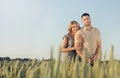 Stunning sensual young couple in love posing in summer field Royalty Free Stock Photo