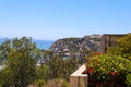 A stunning shot of the boats and the yachts in the Dana Point Harbor from the hillside above with vast blue ocean water Royalty Free Stock Photo