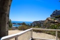 A stunning shot of the boats and the yachts in the Dana Point Harbor through one of the stone arches on the hillside above Royalty Free Stock Photo