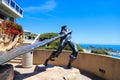 A stunning shot of the The Hide Drogher statue on the Dana Point Bluff Top Trail with a majestic view of the blue ocean water