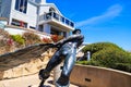 A stunning shot of the The Hide Drogher statue on the Dana Point Bluff Top Trail with a majestic view of the blue ocean water