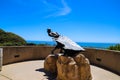 A stunning shot of the The Hide Drogher statue on the Dana Point Bluff Top Trail with a majestic view of the blue ocean water