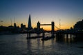 Stunning shot of London's iconic Tower Bridge in England silhouetted against a beautiful sunset sky Royalty Free Stock Photo