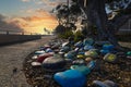 A stunning shot of a rock memorial along a bike path at the beach with colorful rocks and lush green trees with blue sky