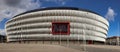 Stunning shot of the San Mames stadium against a backdrop of a dramatic cloudy blue sky