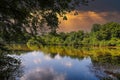 A stunning shot of the the silky brown waters of the Chattahoochee river surrounded by lush green trees and plants