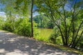 A stunning shot of the silky green lake water of Candler Lake surrounded by lush green trees on the banks of the lake