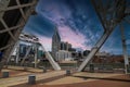 A stunning shot of the skyscrapers and office buildings in the cityscape from the bridge with powerful clouds in downtown Royalty Free Stock Photo