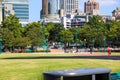 A stunning shot of the skyscrapers and office buildings in downtown Atlanta and Centennial Olympic Park with lush green trees Royalty Free Stock Photo