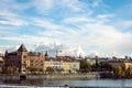 Stunning skyline of Prague, situated near a tranquil shoreline.