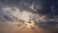 Stunning skyscape background. cloudy evening with the beautiful color of sunlight, sunbeams, rays shines through heavenly clouds. Royalty Free Stock Photo