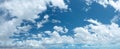 Stunning skyscape with cumulus clouds. Cloudy sky panorama Royalty Free Stock Photo