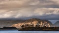 Stunning soft light landscape image of Loch Leven in Scottish Highlands with glowing evening light on fells in distance Royalty Free Stock Photo