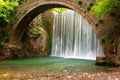 Stunning spring landscape.Paleokarya, old, stone, arched bridge, between two waterfalls.