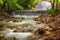 Stunning spring landscape.Paleokarya, old, stone, arched bridge, between two waterfalls.