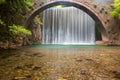 Stunning spring landscape.Paleokarya, old, stone, arched bridge, between two waterfalls.