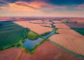 Stunning summer sunset on outskirts of Ternopil town with two lakes and asphalt road. Royalty Free Stock Photo