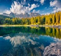 Stunning summer view of Carezza Karersee lake.