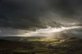 Beautiful sunbeams over Big Moor in the Peak District landscape