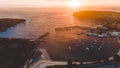 Stunning sunrise with boats at Ulladulla Harbour on the South Coast of NSW, Australia