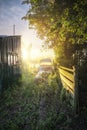 Stunning sunrise glow over foggy river house in countryside land