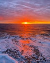 Stunning sunrise over ocean in early morning as sun rises Royalty Free Stock Photo