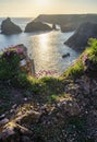 Beauitful sunrise and sunset landscape image of Kynance Cove in Cornwall England with colourful sky Royalty Free Stock Photo