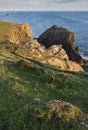 Beauitful sunrise and sunset landscape image of Kynance Cove in Cornwall England with colourful sky Royalty Free Stock Photo