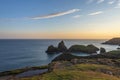 Beauitful sunrise and sunset landscape image of Kynance Cove in Cornwall England with colourful sky Royalty Free Stock Photo