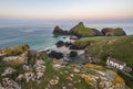 Beauitful sunrise and sunset landscape image of Kynance Cove in Cornwall England with colourful sky Royalty Free Stock Photo