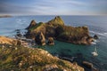 Beauitful sunrise and sunset landscape image of Kynance Cove in Cornwall England with colourful sky Royalty Free Stock Photo