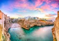 Stunning sunset at Cala Paura gulf with Bastione di Santo Stefano and Lama Monachile beach in background Royalty Free Stock Photo